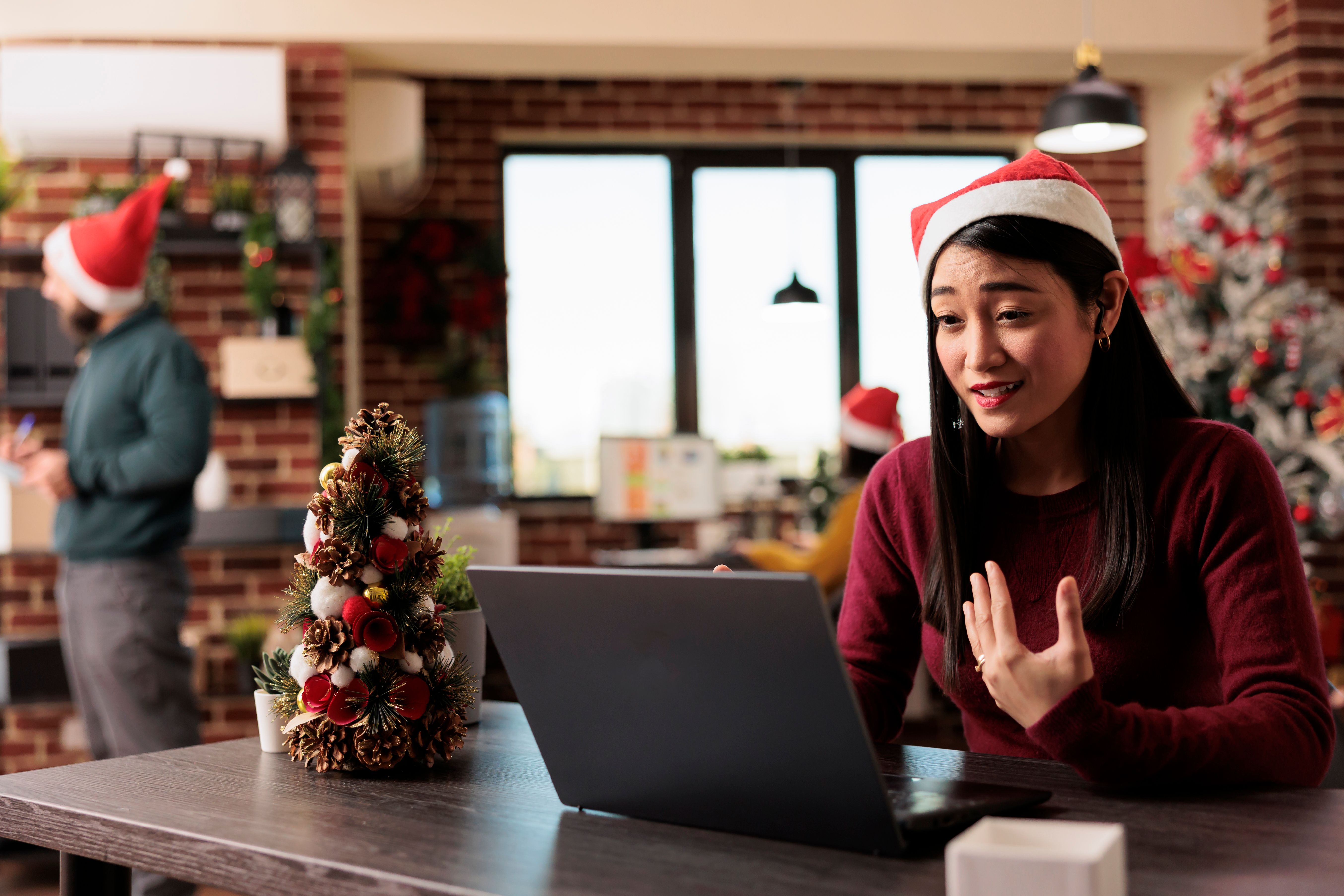 woman-santa-hat-chatting-vieocall.jpg